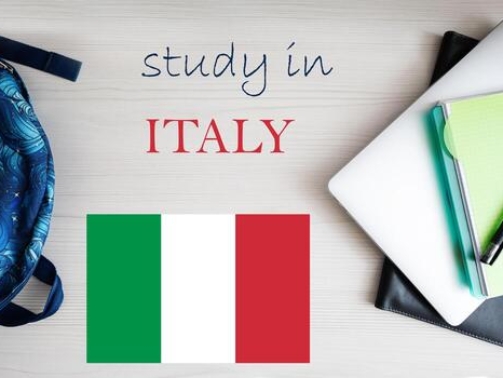 study-in-italy-background-with-notepad-laptop-and-backpack-education-concept-photo