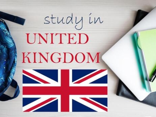 study-in-united-kingdom-background-with-notepad-laptop-and-backpack-education-concept-photo