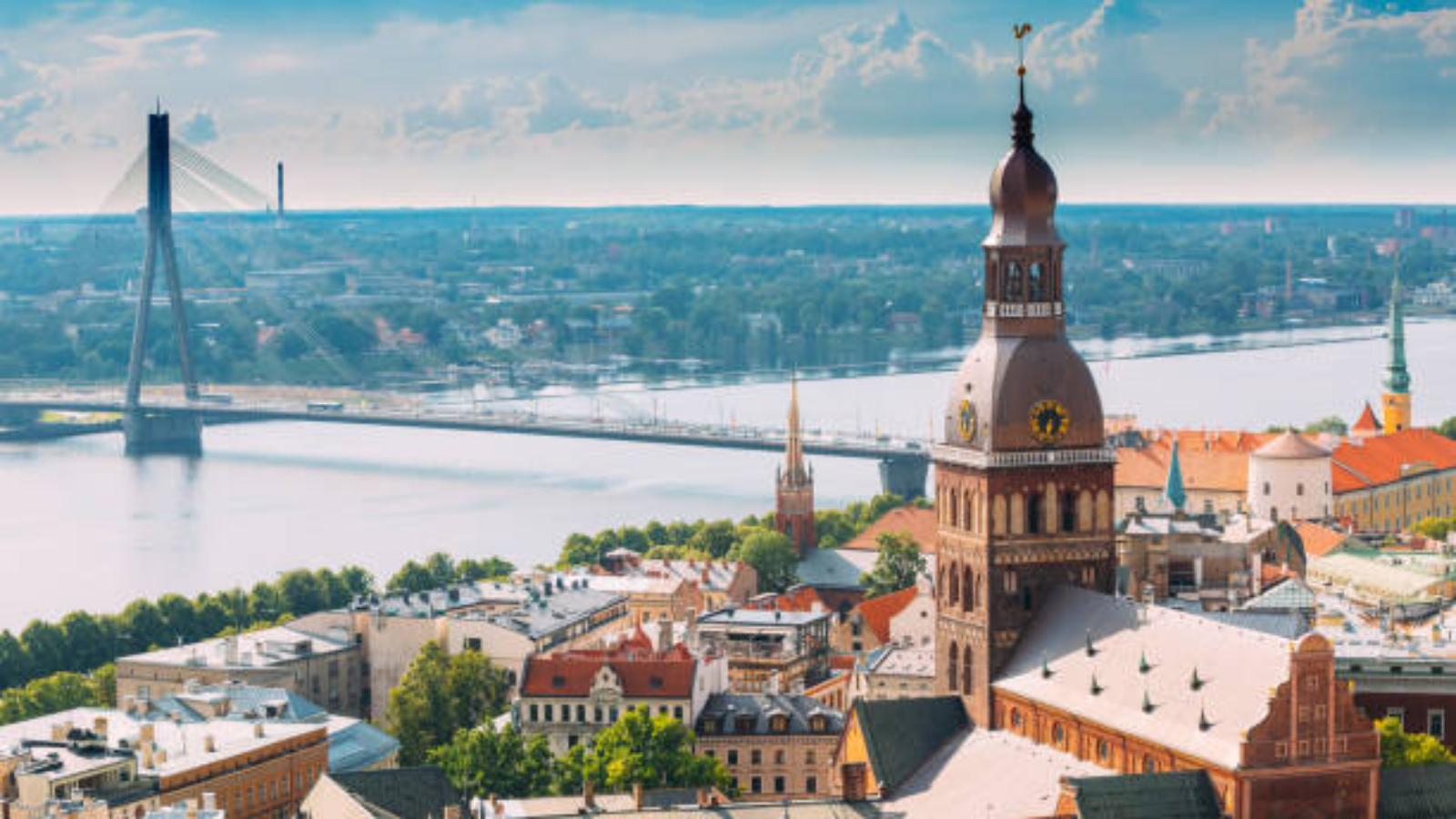 Riga, Latvia. Riga Cityscape In Sunny Summer Day. Famous Landmark - Riga Dome Cathedral