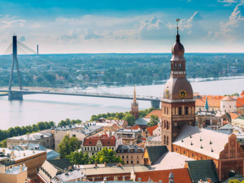 Riga, Latvia. Riga Cityscape In Sunny Summer Day. Famous Landmark - Riga Dome Cathedral